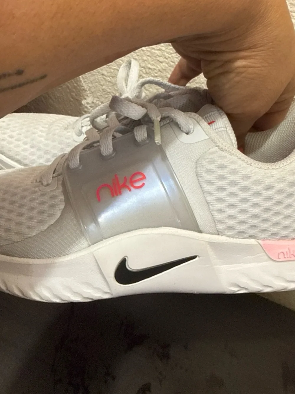 Nike Women’s White Athletic Trainers with Pink Logo